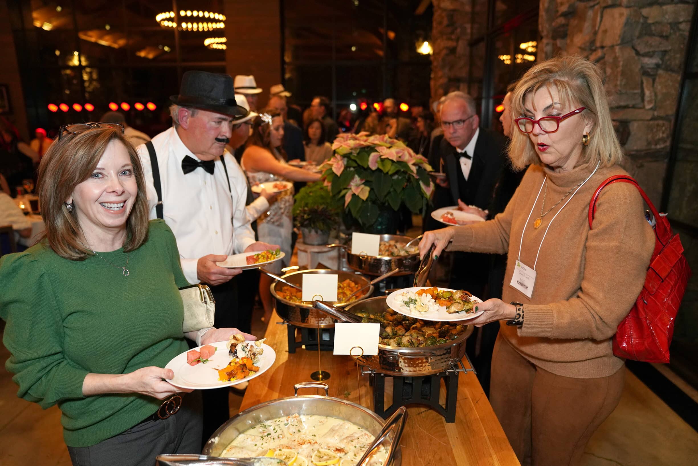 Oncology professionals enjoying dinner at a North Carolina Oncology Management Society conference